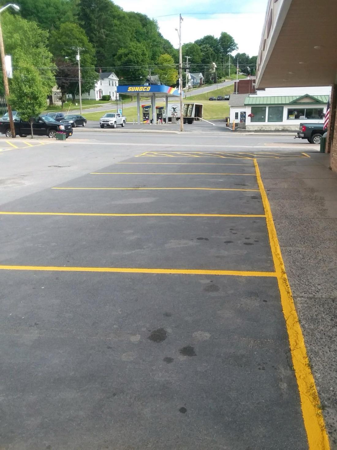 Yellow-striped parking spaces at Mario's Pizza in Oriskany Falls