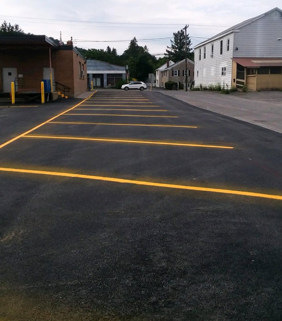 Freshly painted yellow parking lines at the West Winfield Post Office